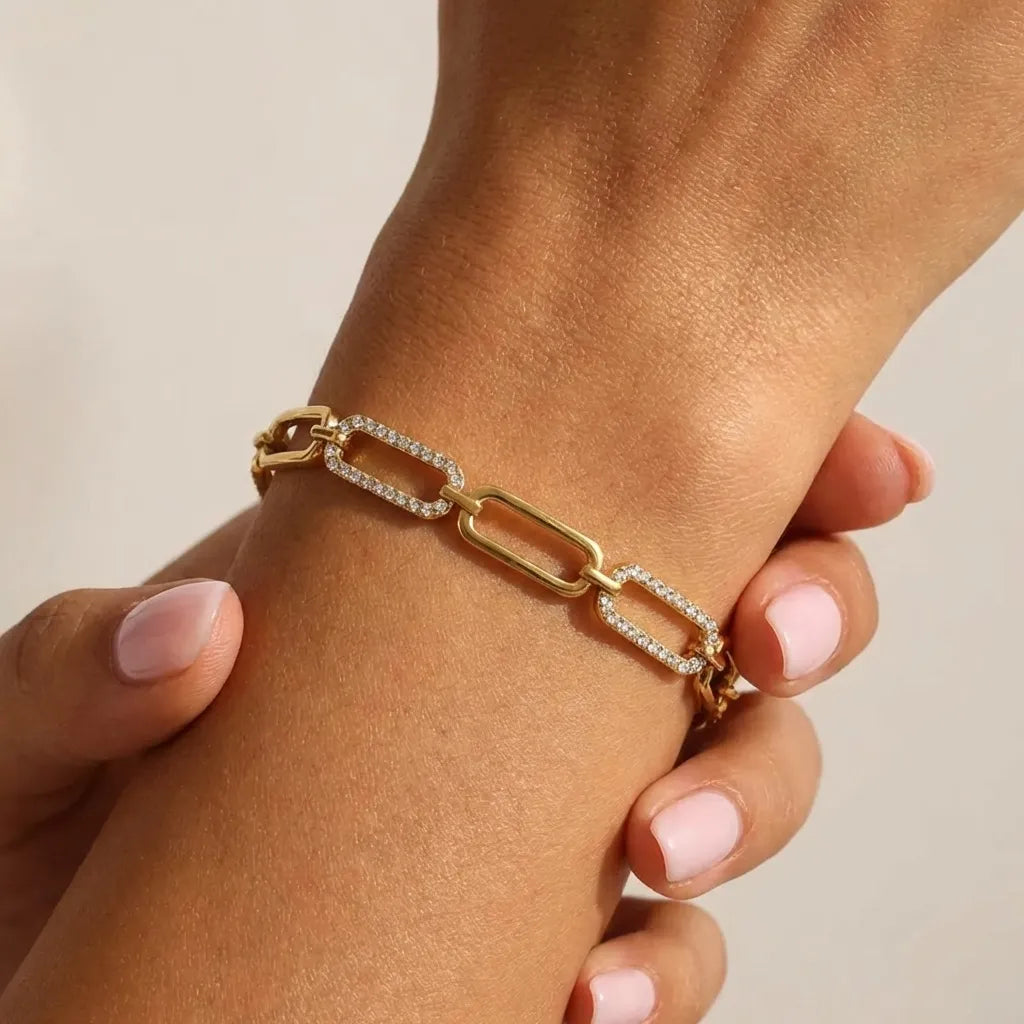 Sofia gold link bracelet on the wrist, long links alternating between plain and crystal-lined