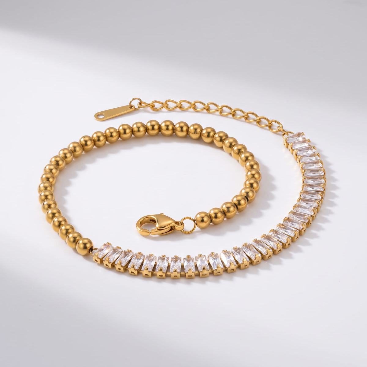 Vida baguette bead gold bracelet on a plain white surface