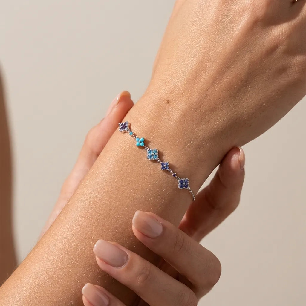Aurélie Silver Cluster bracelet on the wrist with navy, violet and turquoise clover stones