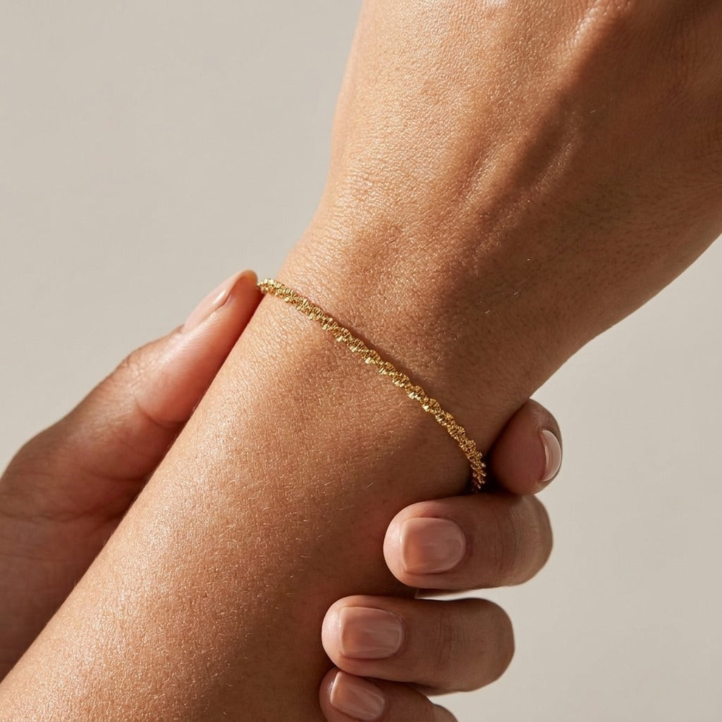 Abigail fine twisted gold chain bracelet worn on the wrist