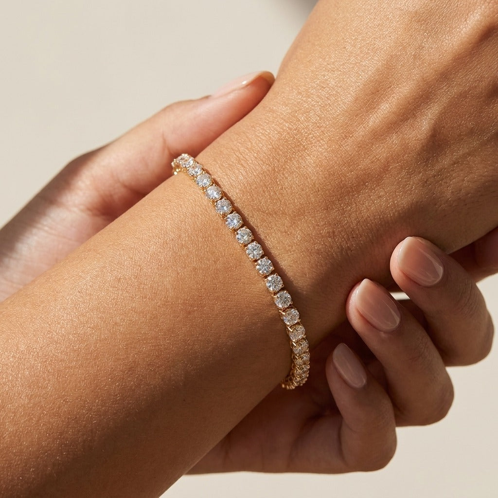 Woman wearing the Lillian gold tennis bracelet with round prong-set crystals on the wrist