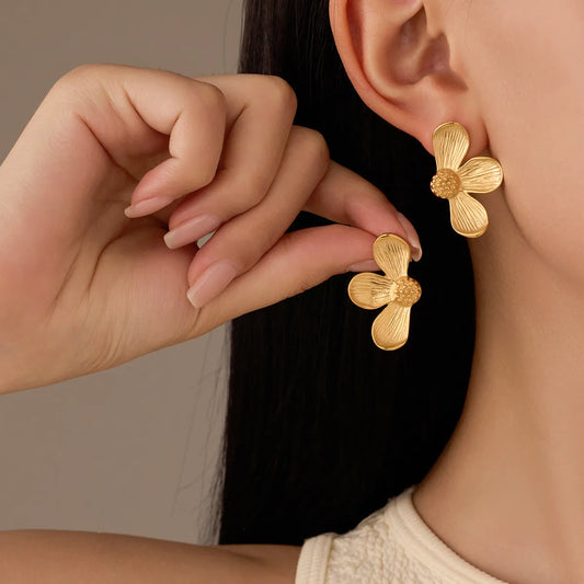 Gold flower-shaped earrings
